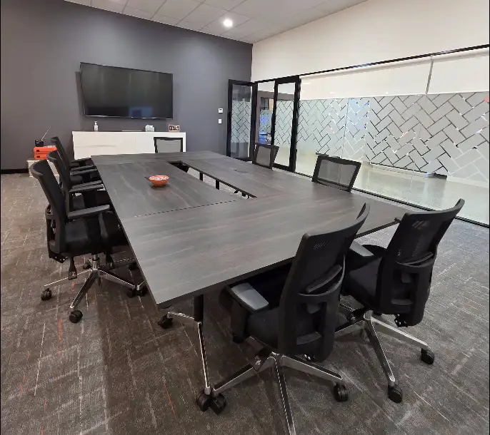Boardroom with conference table and office chairs